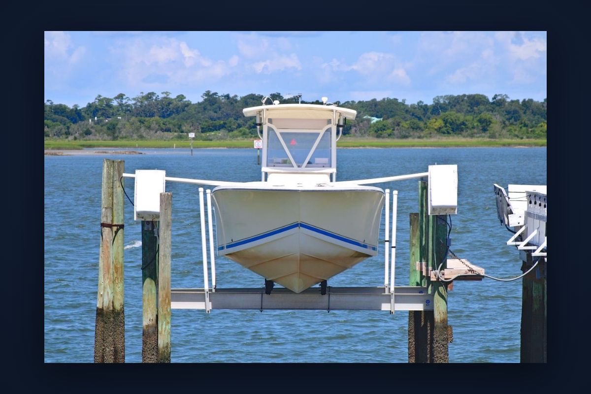 A boat raised on a canal-front boat lift