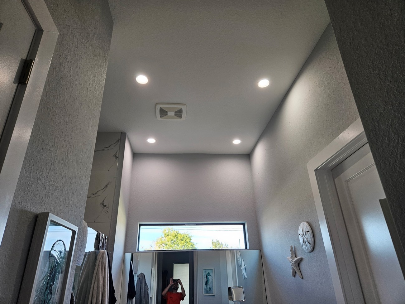 Recessed can lighting installed in a finished residential ceiling