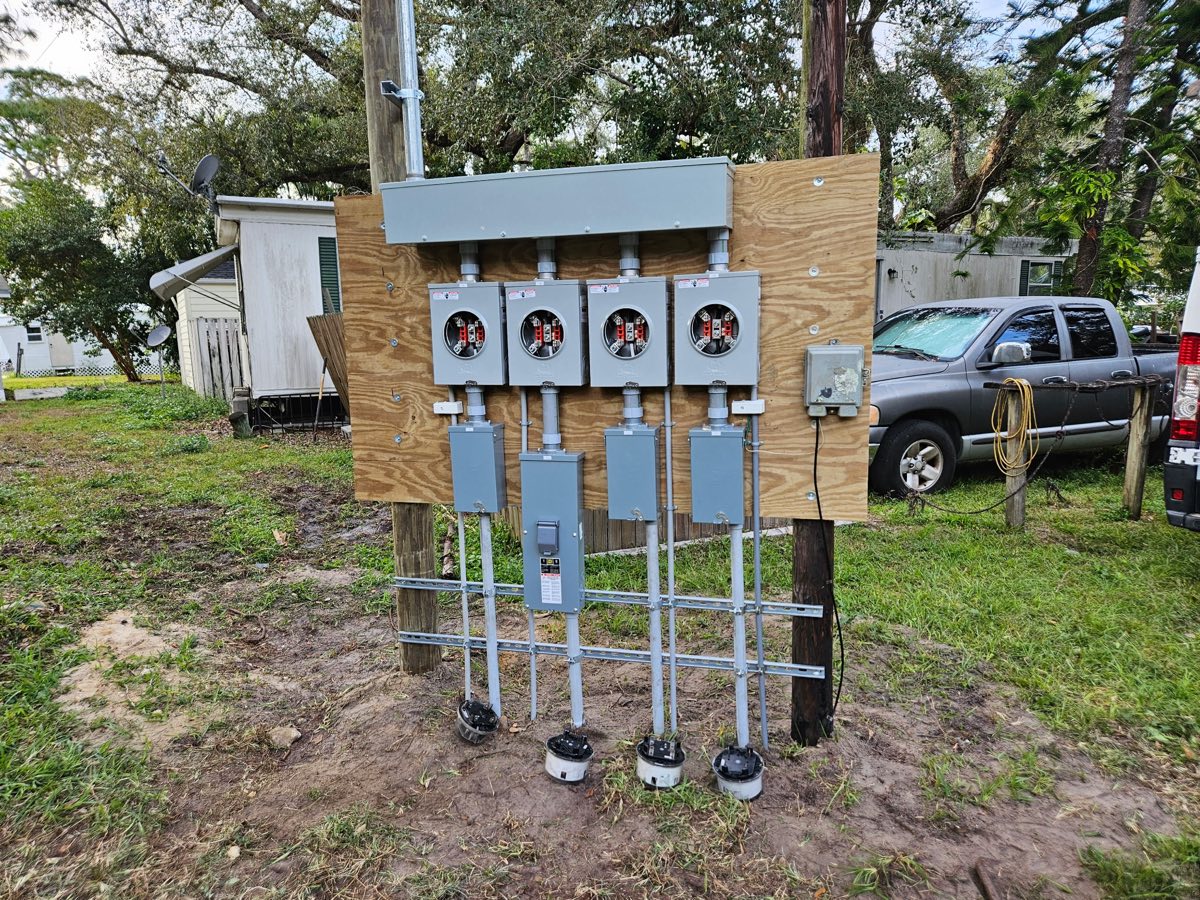 Rebuilt multi-meter service bank with new conduit and disconnects