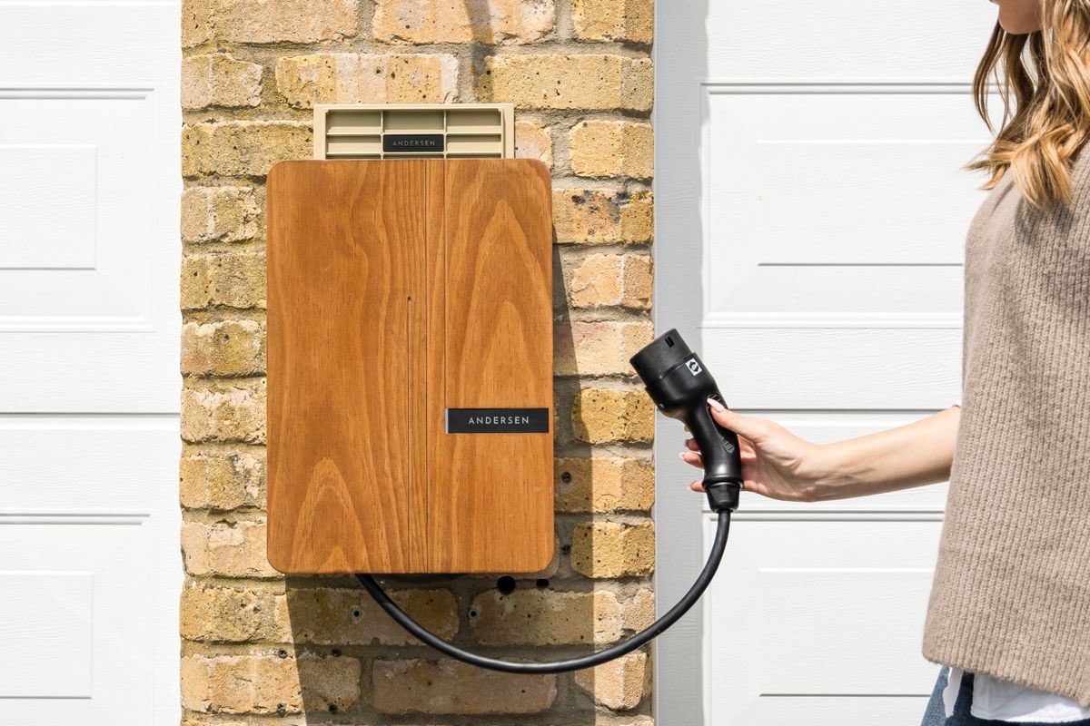 Level 2 home EV charger mounted on an exterior wall